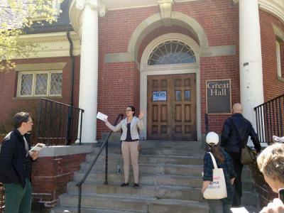 Gabriela Figuereo, an intern working with the Dorchester Historical Society, spoke outside the Great Hall during a walking tour of Codman Square last Saturday. Meggie Quackenbush photo